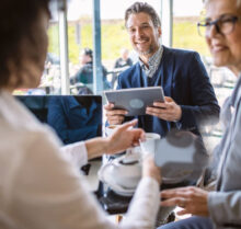 Photo of  business people having a meeting in a cafe.